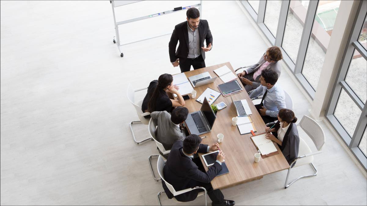 Employees gathered at a conference meeting